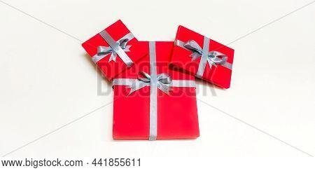 Closeup Of Christmas Gift Boxes Wrapped With Rippon Decorated In A Isolated White Background With Se