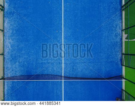 Partial Overhead View Of The Net And Half Of A Paddle Tennis Court