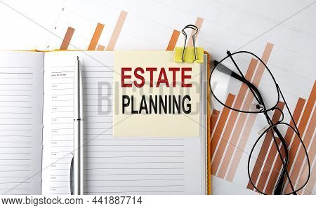 Text Estate Planning On Sticker On Notepad On Diagram Background