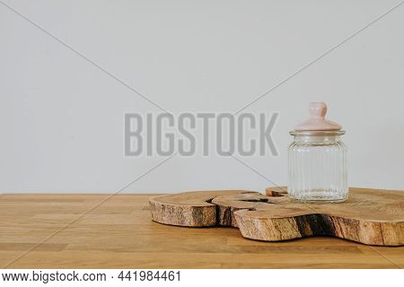 Glass Jar On Wooden Table With Copy Space