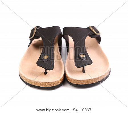 A couples brown sandals close-up.