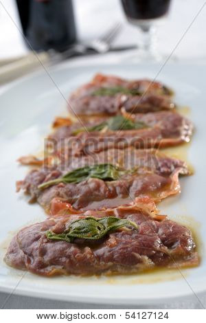 Saltimbocca alla Romana on a rustic table