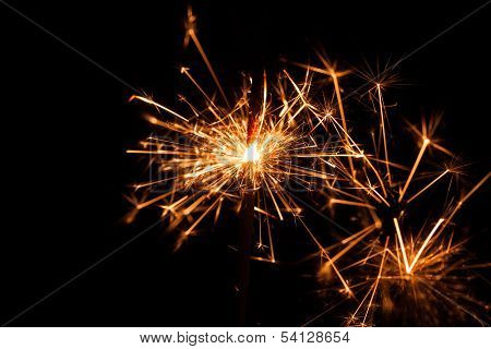 Christmas Sparkler On Black Background. Bengal Fire