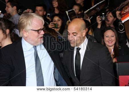 LOS ANGELES - NOV 18:  Phillip Seymour Hoffman, Stanley Tucci at the The Hunger Games:  Catching Fire Premiere at Nokia Theater on November 18, 2013 in Los Angeles, CA