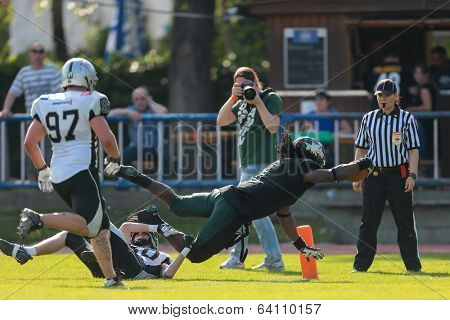 VIENNA,  AUSTRIA - JUNE 8 RB Tunde Ogun (#1 Dragons) scores a touchdown during the AFL football game on June 8, 2013 in Vienna, Austria.