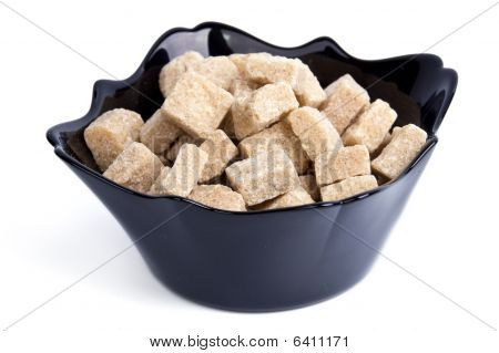Cane Sugar In Black Bowl