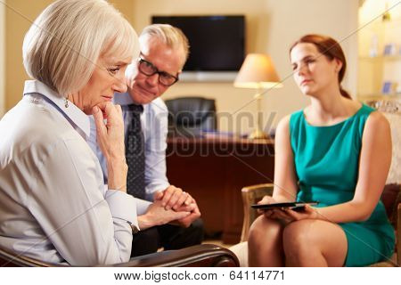 Older Couple Talking To Counsellor Using Digital Tablet