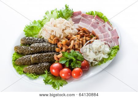 Assorted Pickles. Appetizer Of Tomatoes, Cucumbers, Onions And Lettuce