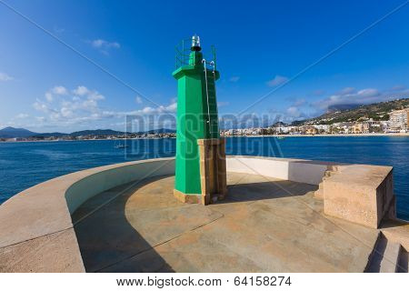 Javea Xabia green lighthouse beacon at Port in Alicante Mediterranean Spain