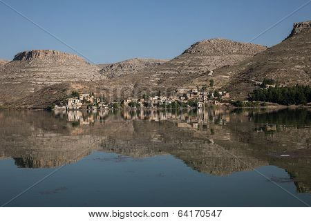 reflected village and hills