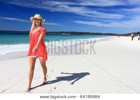Happy Woman Walking Along Beautiful Beach
