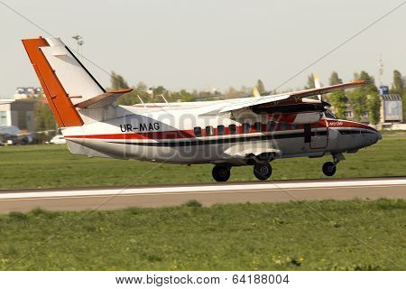 Magellan Let L-410UVP Turbolet aircraft landing on the runway
