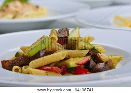 Pasta with shrimps, herbs and mashrooms isolated on white background in studio