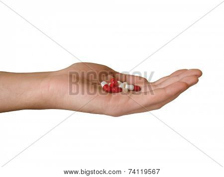 Hand with pills, isolated on white background (clipping path)