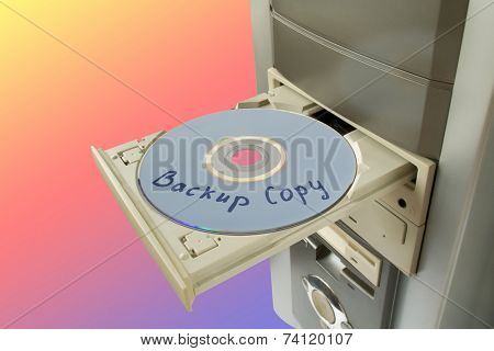 Disc Backup copy in tray, rainbow background