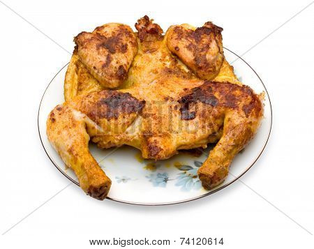Roasted chicken on plate, isolated on white (clipping path)