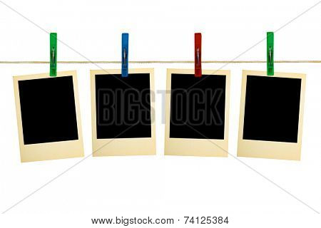 Retro photography on clothespins, isolated on white background