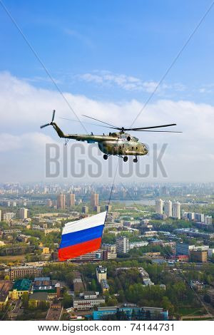 Helicopter with russian flag over Moscow at parade of victory day - aerial view