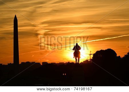 Washington DC - Ulysses S. Grant Memorial and Washington Monument silhouettes in sunset 