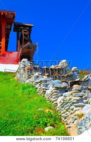 Old syle house with water mill