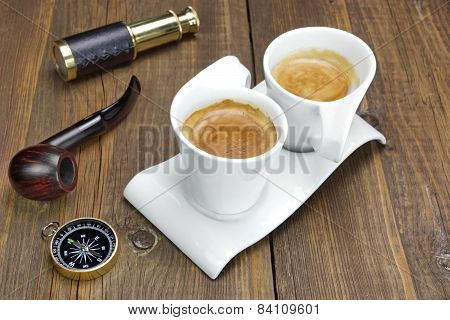Spyglass, Compass, Smoking Pipe And Two White Espresso Coffee Cups