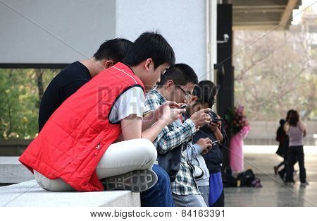 Young People Are Busy With Their Smartphones