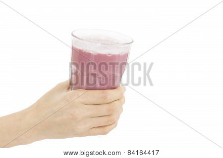 Close Up Of Hand Holding A Glass Of Berry Smoothie