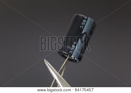 Electronic Capacitor In Black Background