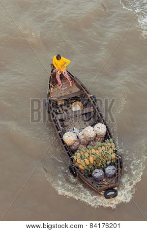 Woman on boat at Can Tho Floating Market