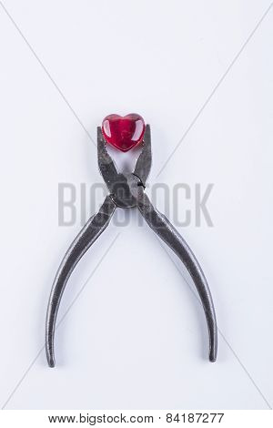 red glass heart on the white background
