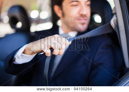Portrait of an handsome guy using the safety belt