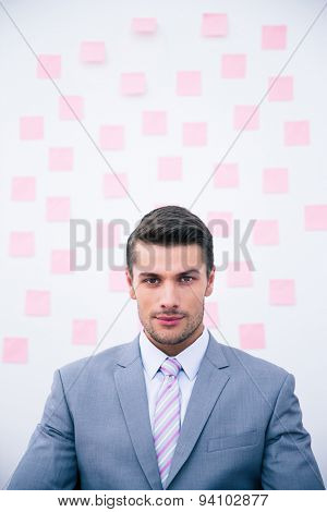 Portrait of a young confident businessman looking at camera