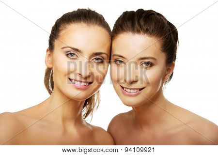 Two attractive sisters with make up.