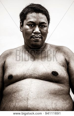 Fat Naked Upper Body And Belly Stomach Of An African Tribal Man Showing Proud Expression On His Face