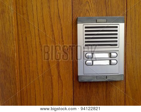 Old Intercom Over Wooden Door