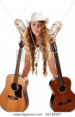 Sesy cowgirl in cowboy hat with acoustic guitar