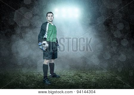 Soccer player with ball in action outdoors