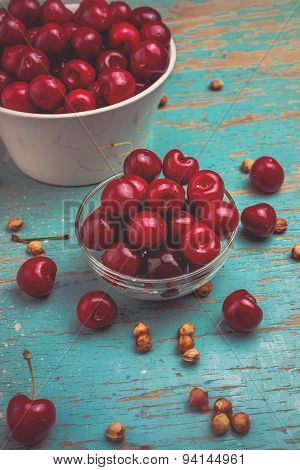 Sweet Cherry In Bowl On Rustic Table