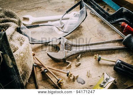 Different tools on a wooden background.