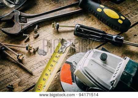 Different tools on a wooden background.