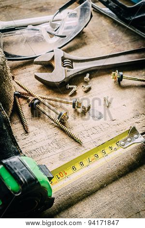 Different tools on a wooden background.