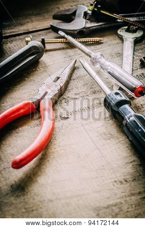 Different tools on a wooden background.