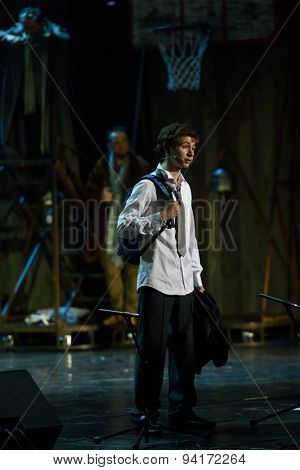 ST. PETERSBURG, RUSSIA - JUNE 19, 2015: Boy performing the role of Mowgli in a scene from a children's charity project titled Mowgli Generation. The performance is part of the SPIEF 2015