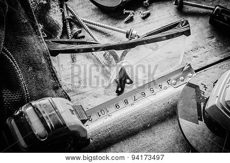 Different tools on a wooden background.
