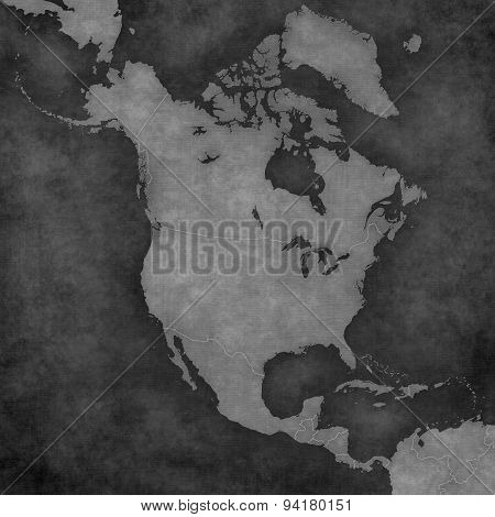 Blank map of North America with country borders. The map is in vintage black and white style. The map has soft grunge and retro old paper atmosphere.