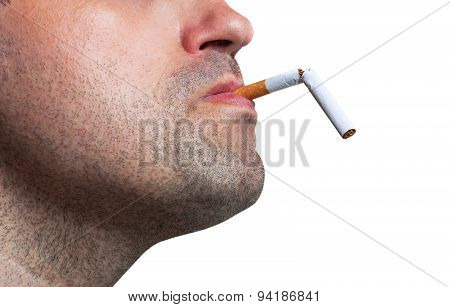 Man Holding A Broken Cigarette In His Mouth