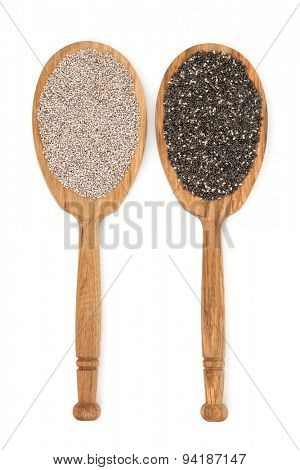 Chia seed in oak wood spoons over white background. Salvia Hispanica.