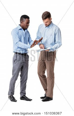 African-American and Caucasian businessman discussing a contract and a quarrel on a white background. a disadvantage
