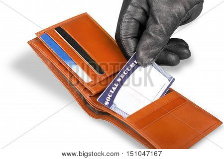 Hand in Glove Stealing a Social Security Card from a Wallet