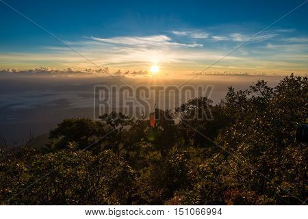 Sunrise On The Peak Of Mountains With Fog